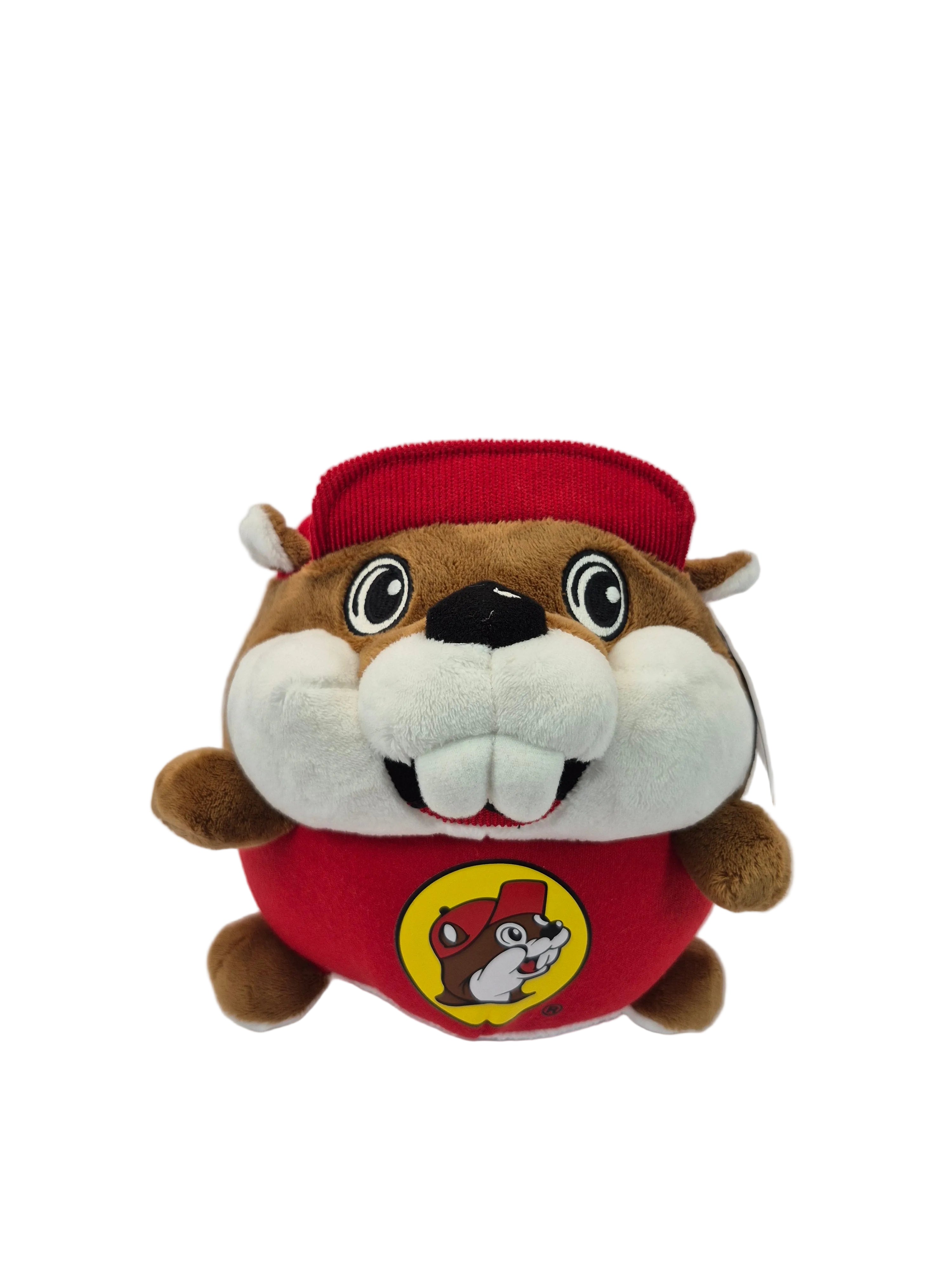 Plush toy resembling a beaver with a red hat on a white background