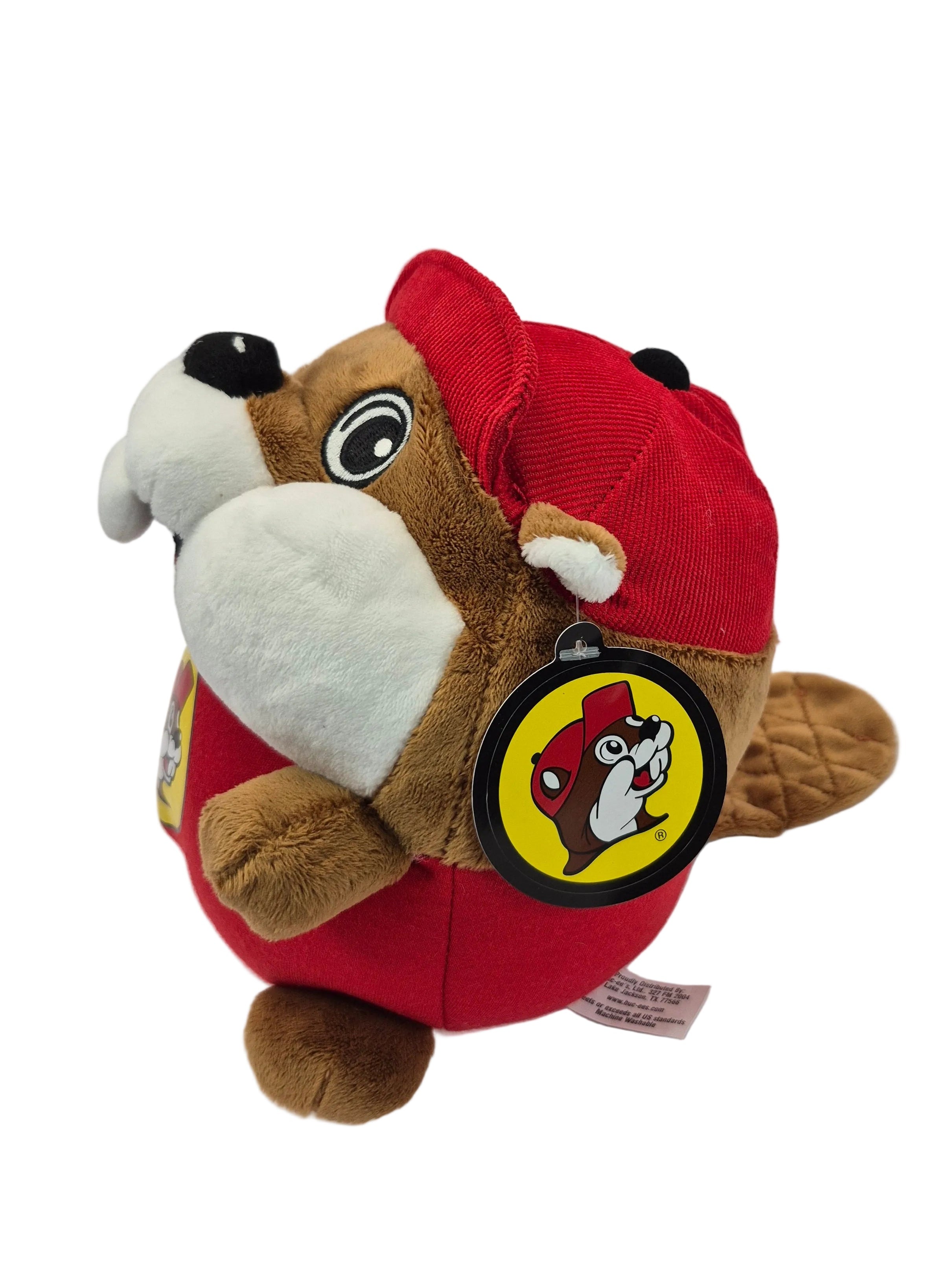 Plush toy resembling a beaver in a red outfit with a logo on a white background