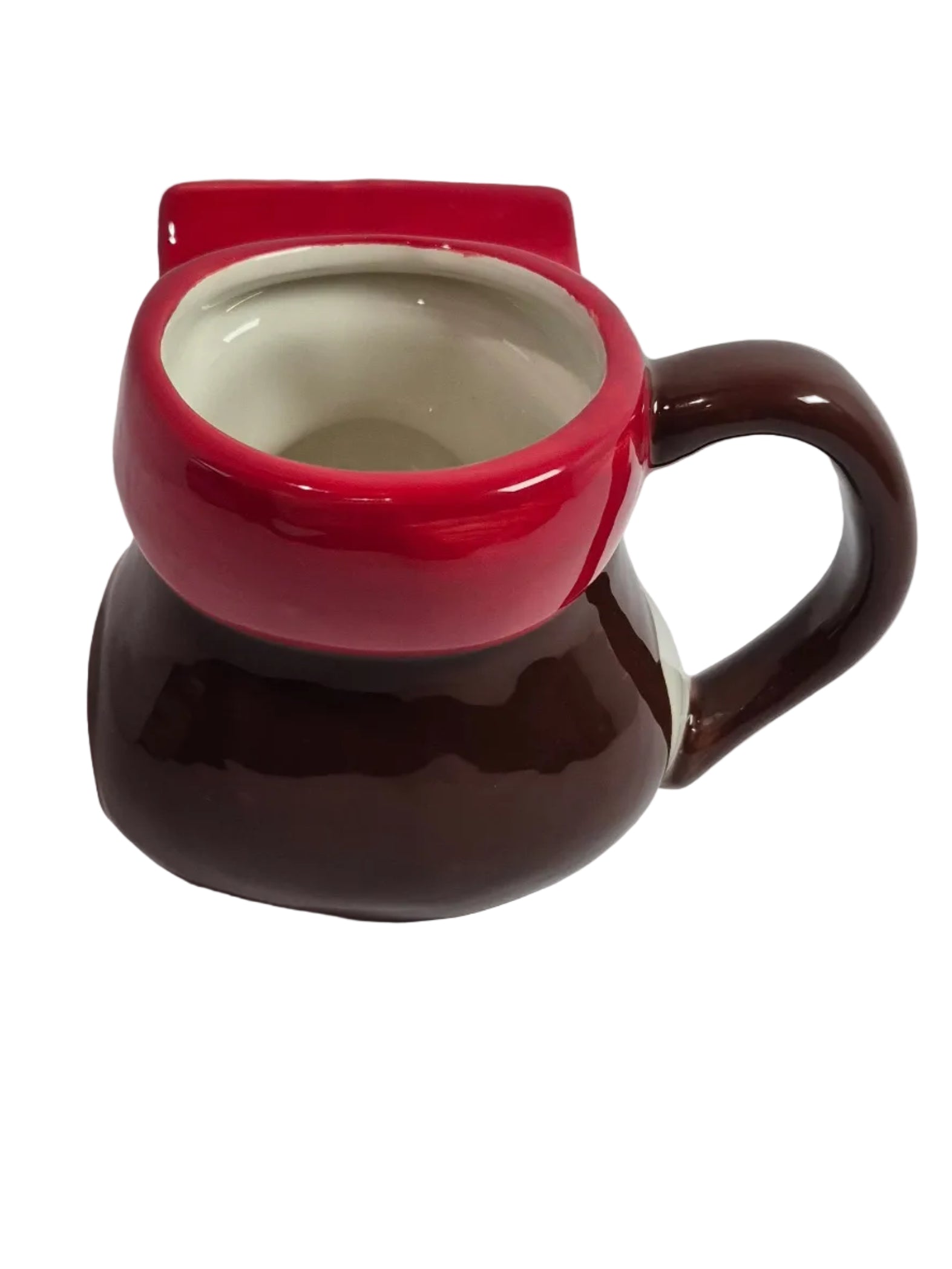 Red and brown ceramic mug with a unique design on a white background