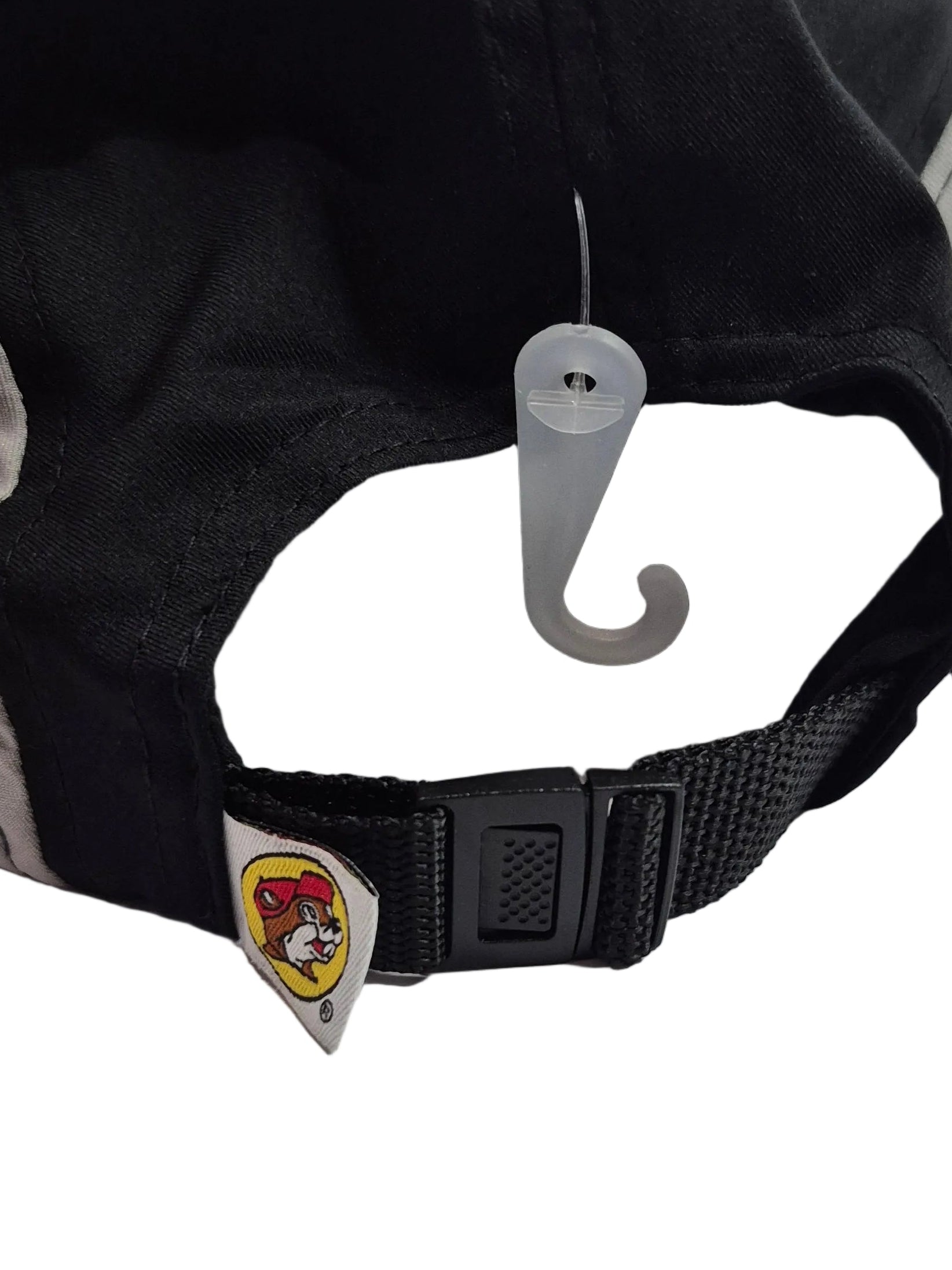 Back strap of Black cap with 'Buc-ee's' logo on a white background