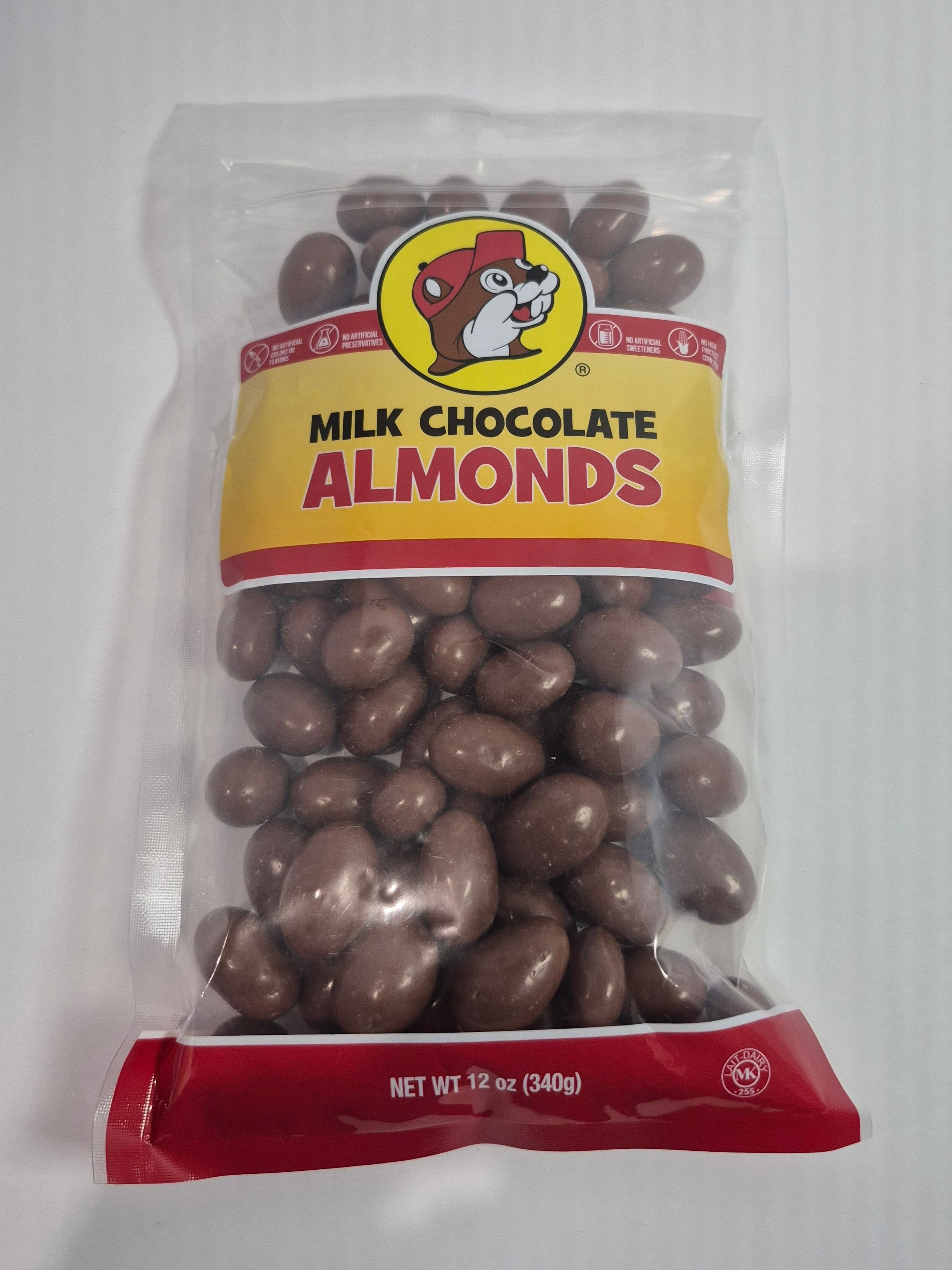 Packaged milk chocolate almonds with a visible brand logo on a white background
