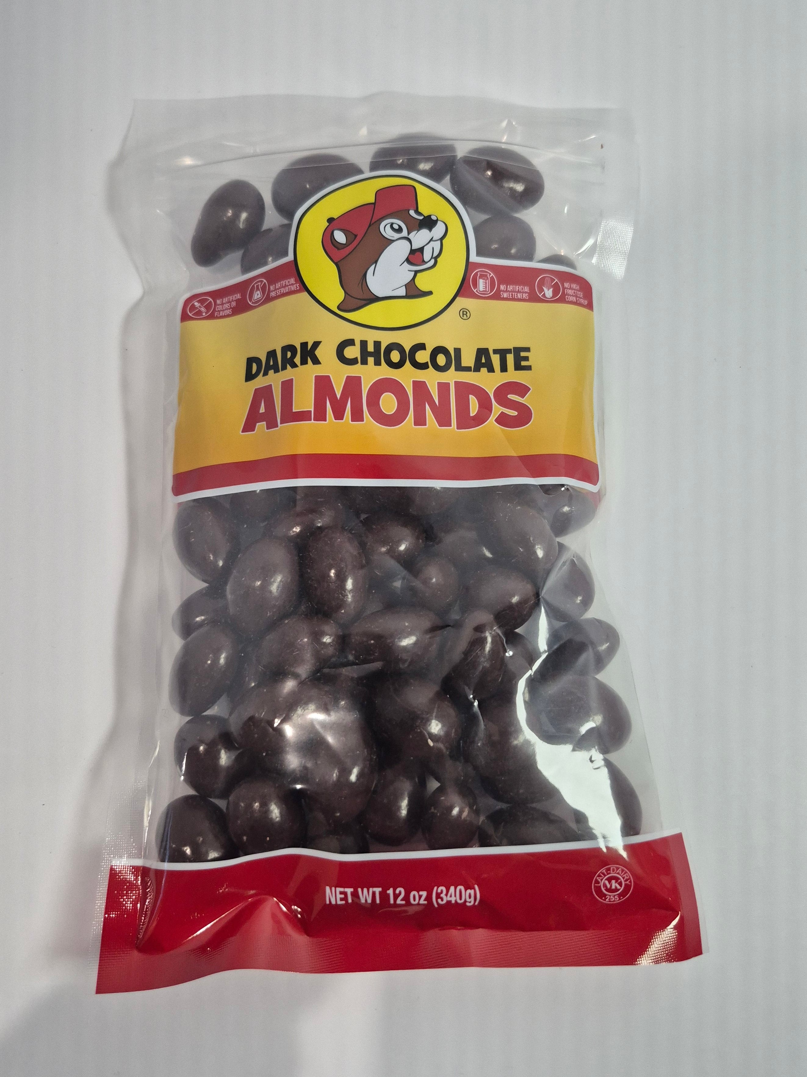 Packaged dark chocolate almonds with a visible brand logo on a white background