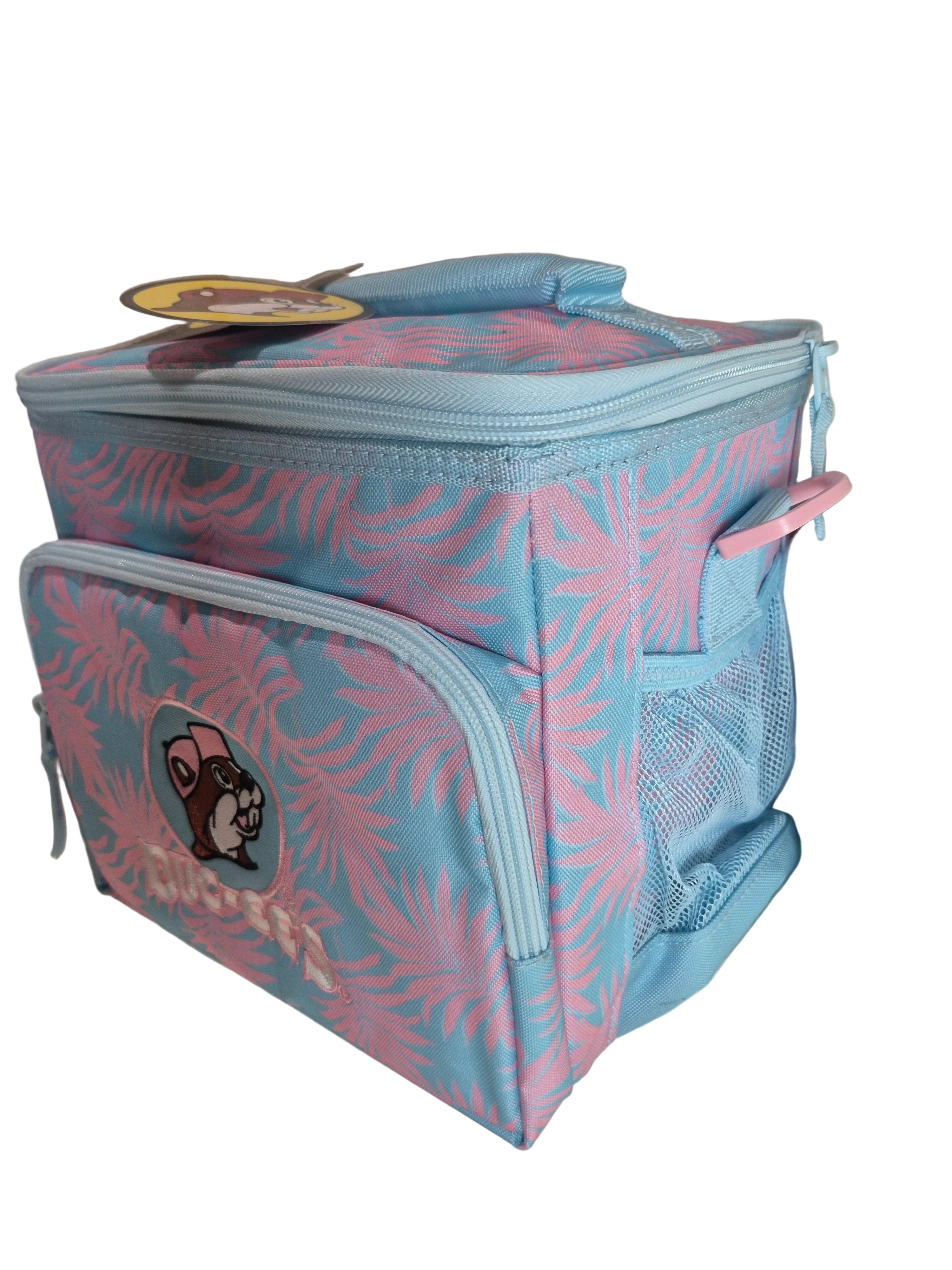 Pink and blue patterned bag on a beige surface