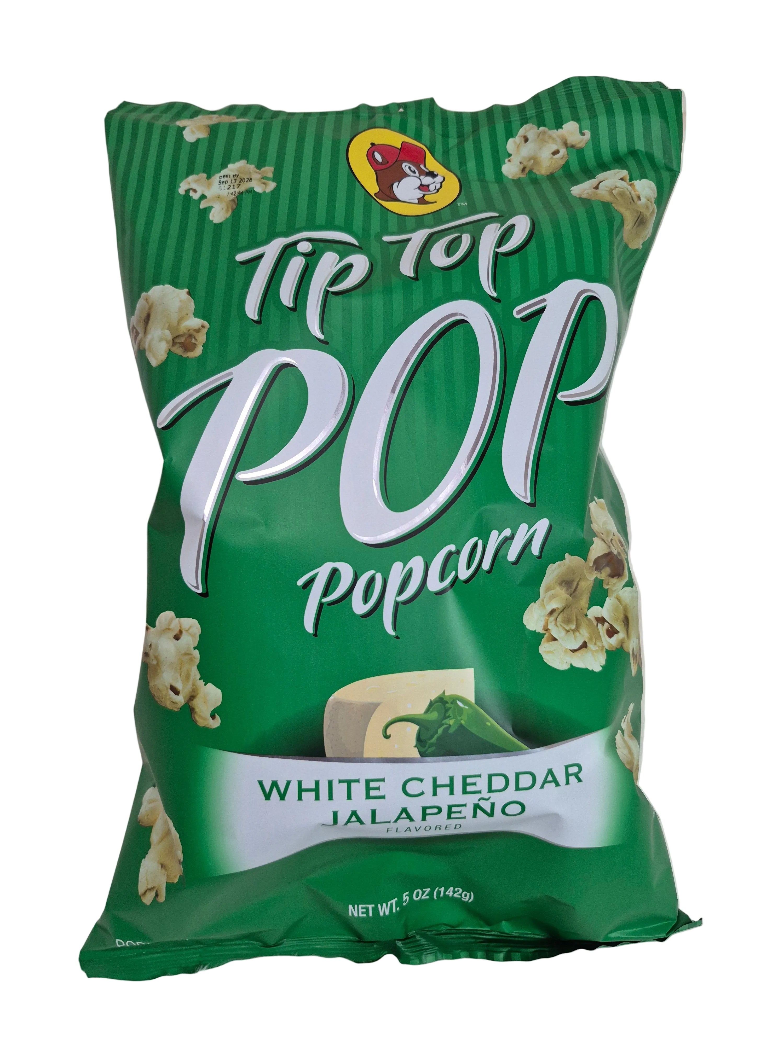 Green bag of Tip Top Pop popcorn with white cheddar jalapeño flavor on a light background